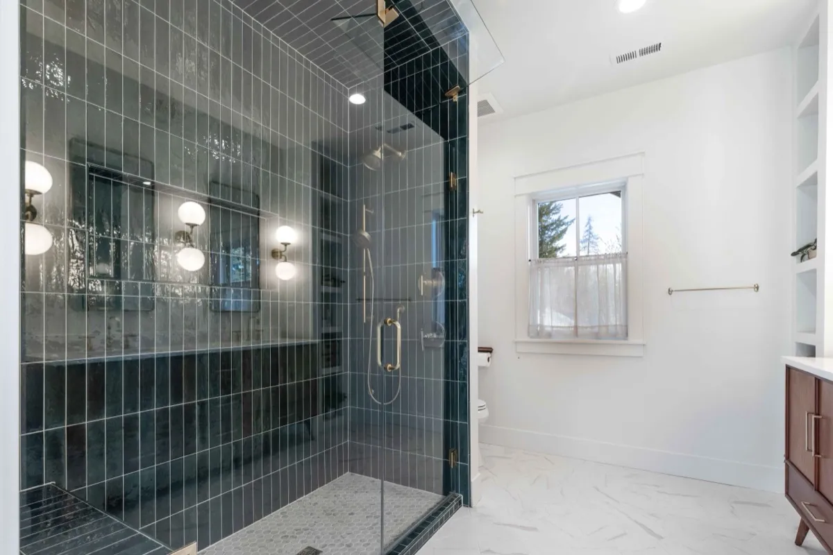 Remodeled primary bathroom shower with tile detail