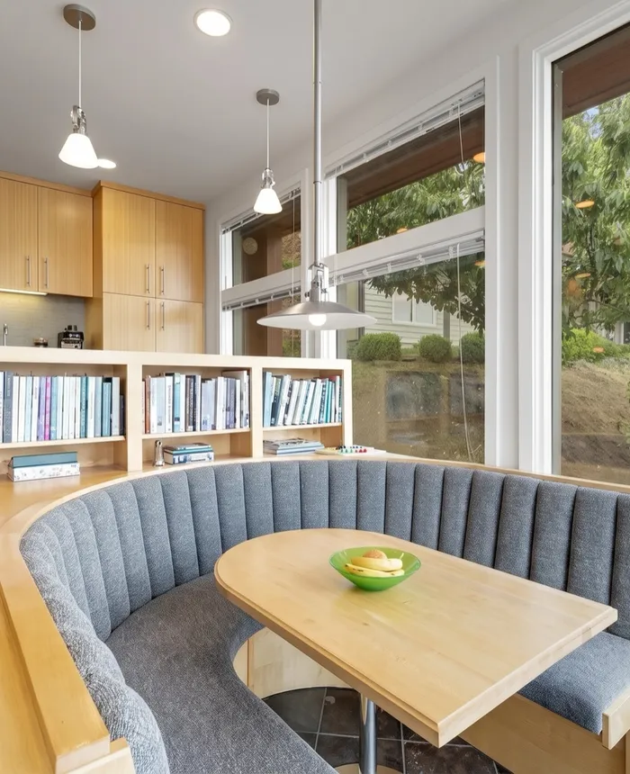 Built-in breakfast nook with a curved upholstered bench