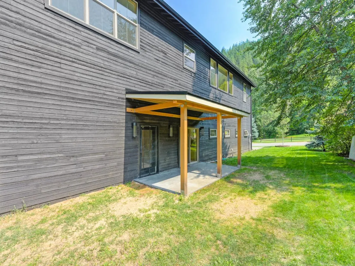 Covered outdoor patio structure with timber framing