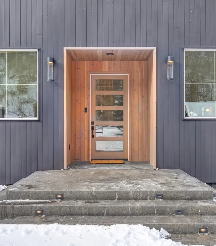 Detail of a custom front entry door and trim