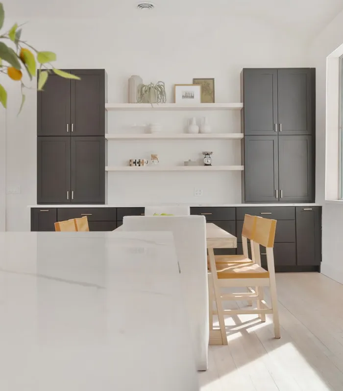 Compact kitchen and built-in dining nook, the kind of efficient layout an ADU calls for